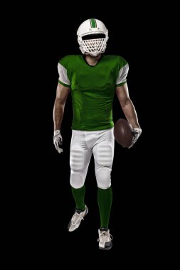 Futbolcu yeşil üniforma ile