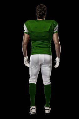 Futbolcu yeşil üniforma ile