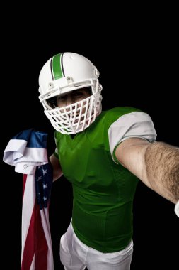 Futbolcu yeşil üniforma ile