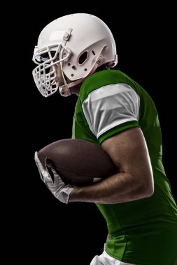 Futbolcu yeşil üniforma ile