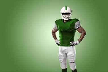 Futbolcu yeşil üniforma ile