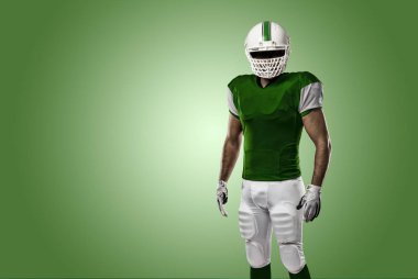 Futbolcu yeşil üniforma ile