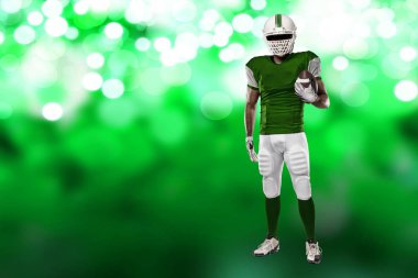 Futbolcu yeşil üniforma ile