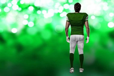 Futbolcu yeşil üniforma ile