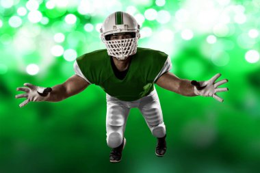 Futbolcu yeşil üniforma ile