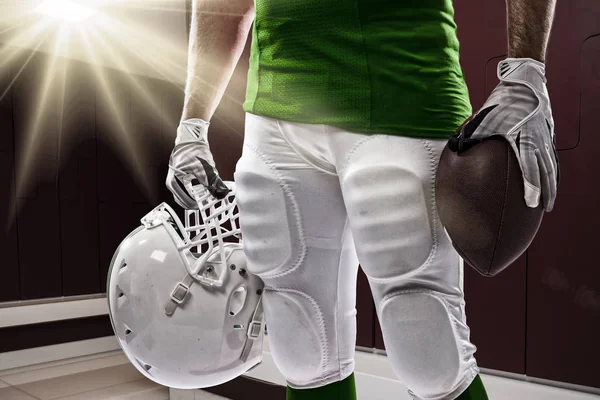 Football Player with a green uniform — Stock Photo, Image