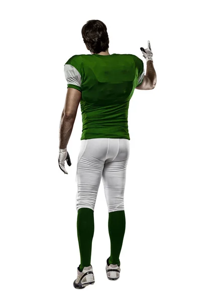 Fotbollsspelare med en grön uniform — Stockfoto