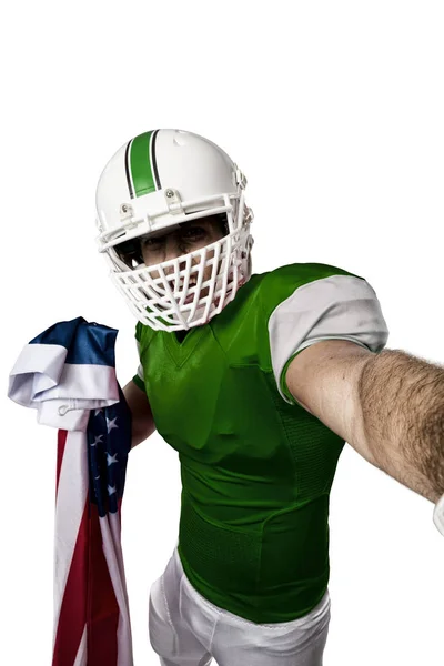 Football Player with a green uniform — Stock Photo, Image