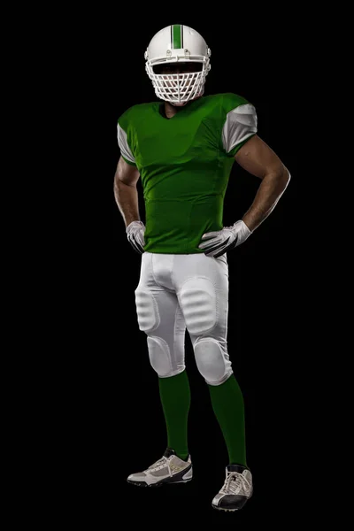 Football Player with a green uniform — Stock Photo, Image