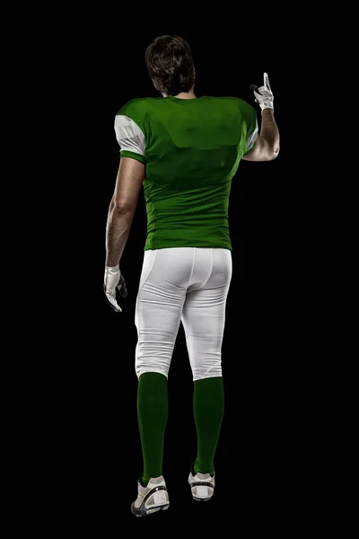 Football Player with a green uniform — Stock Photo, Image