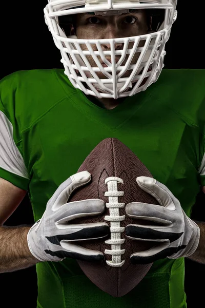 Joueur de football avec un uniforme vert — Photo