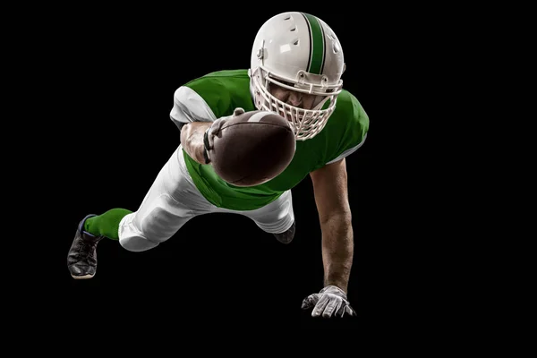 Football Player with a green uniform — Stock Photo, Image