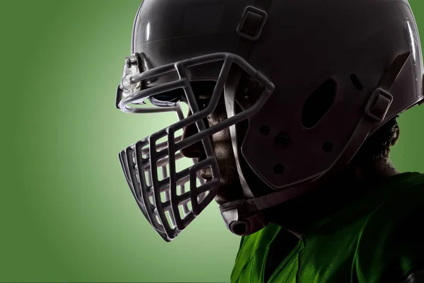 Football Player with a green uniform — Stock Photo, Image