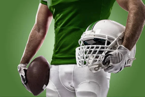 Football Player with a green uniform — Stock Photo, Image