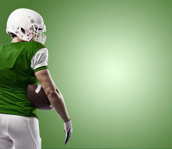 Football Player with a green uniform — Stock Photo, Image