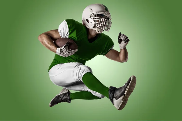 Fotbalista s zelená uniforma — Stock fotografie