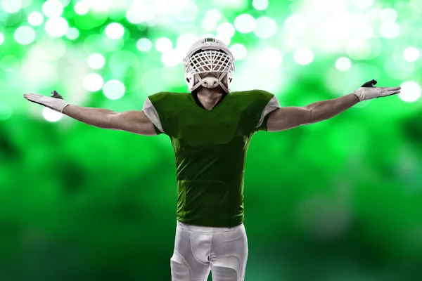 Football Player with a green uniform — Stock Photo, Image