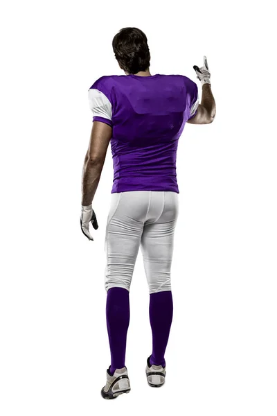 Fotbollsspelare med en lila uniform — Stockfoto