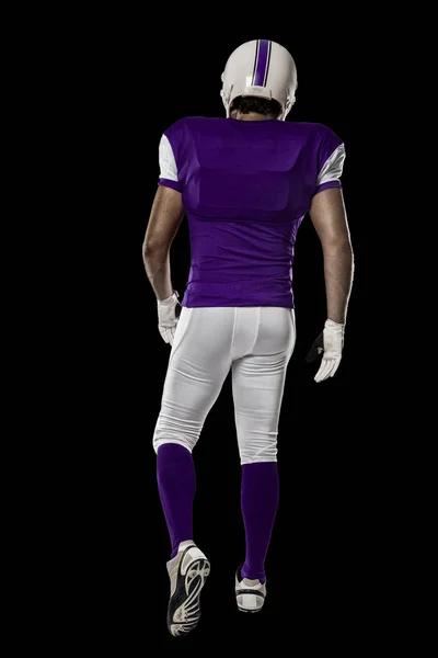 Fotbalista s fialovou uniformu — Stock fotografie