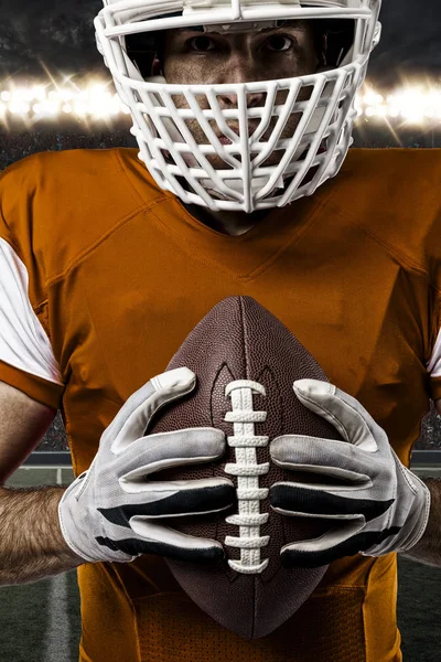 Football Player with a orange uniform — Stock Photo, Image