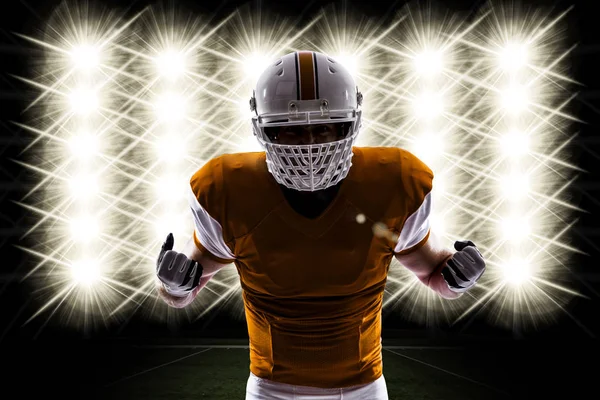 Football Player with a orange uniform — Stock Photo, Image