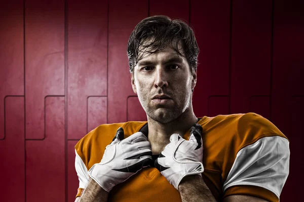 Football Player with a orange uniform — Stock Photo, Image