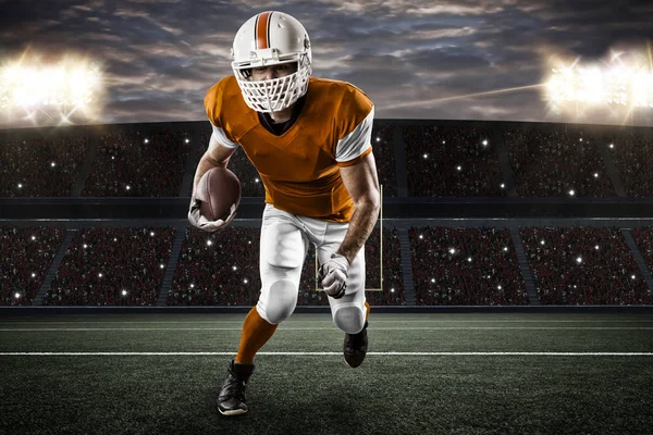 Jugador de fútbol con uniforme naranja —  Fotos de Stock
