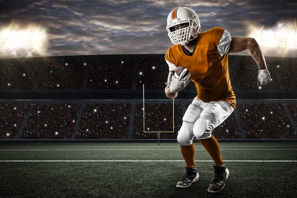 Football Player with a orange uniform — Stock Photo, Image