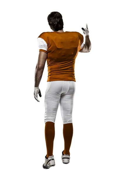 Футболист в оранжевой форме — стоковое фото