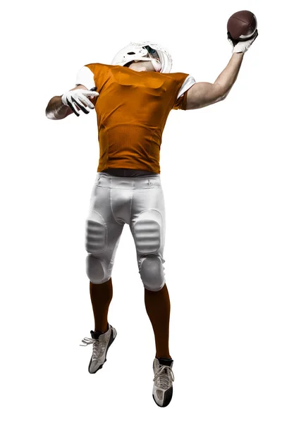 Fotbollsspelare med en orange uniform — Stockfoto
