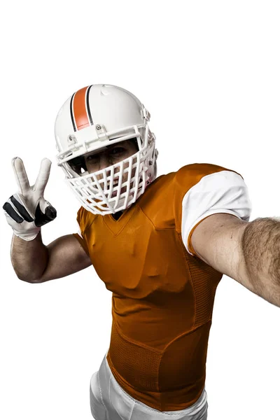 Fotbal jucător cu o uniformă portocalie — Fotografie, imagine de stoc