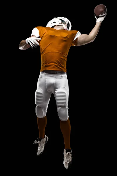 オレンジ色の制服のフットボール選手 — ストック写真