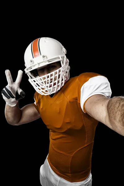 Voetballer met een oranje uniform — Stockfoto