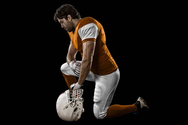 Egy narancssárga egységes labdarúgó — Stock Fotó