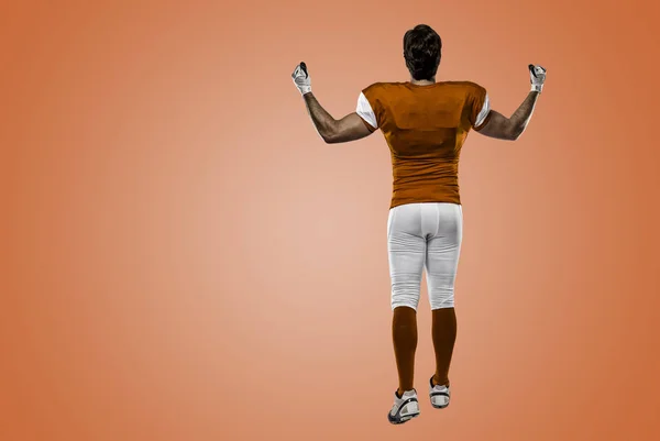 Football Player with a orange uniform — Stock Photo, Image