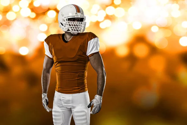 Jogador de futebol com um uniforme laranja — Fotografia de Stock