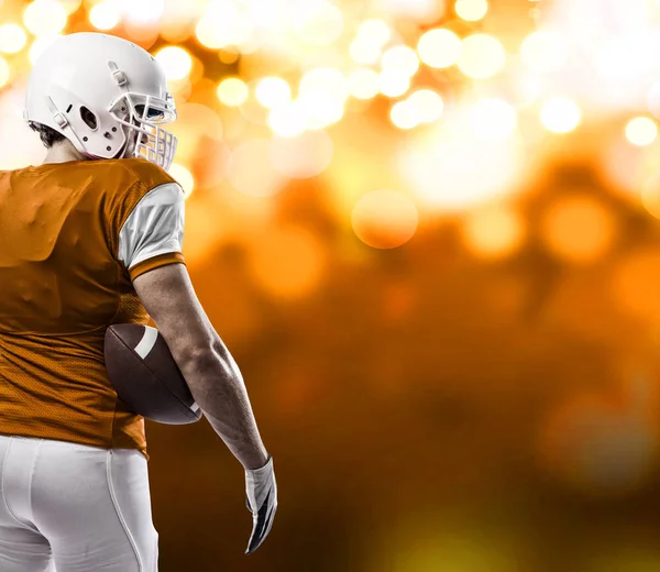 Voetballer met een oranje uniform — Stockfoto