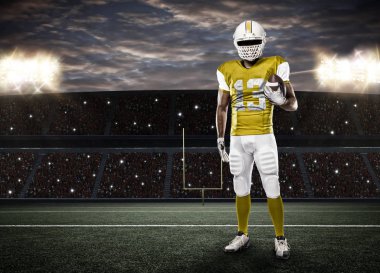 Futbolcu sarı üniforma ile