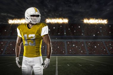 Futbolcu sarı üniforma ile