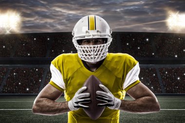 Futbolcu sarı üniforma ile