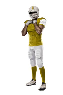 Futbolcu sarı üniforma ile