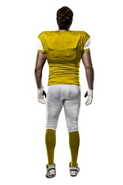 Futbolcu sarı üniforma ile