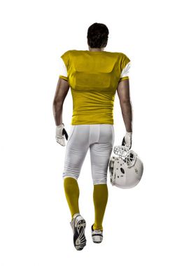 Futbolcu sarı üniforma ile