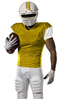 Futbolcu sarı üniforma ile