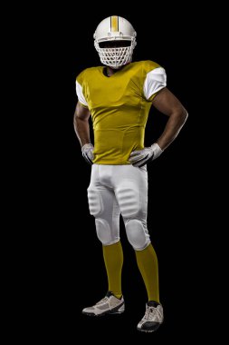 Futbolcu sarı üniforma ile