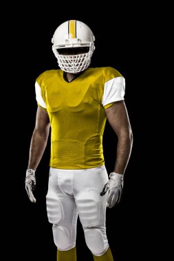 Futbolcu sarı üniforma ile