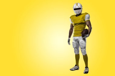 Futbolcu sarı üniforma ile