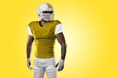 Futbolcu sarı üniforma ile