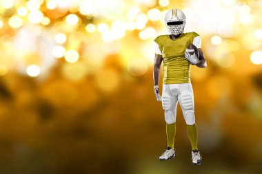 Futbolcu sarı üniforma ile