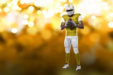 Futbolcu sarı üniforma ile